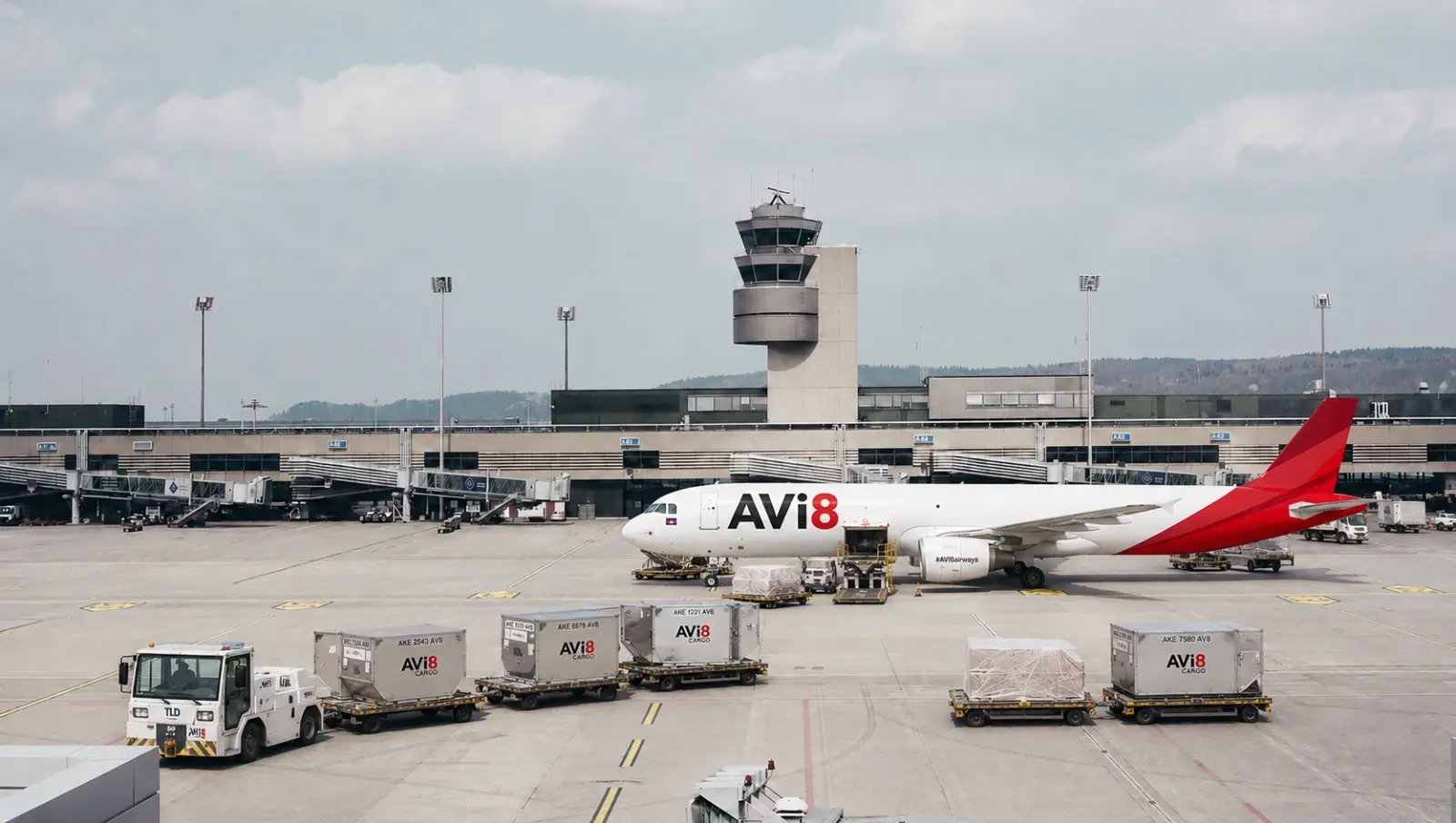 AVi8 cargo aircraft and containers on an airport apron